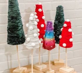 s 15 alternative christmas trees you need to see before december, Make a magical Christmas tree forest from colorful yarn