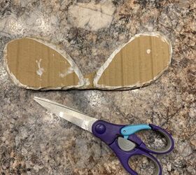 She cuts this shape out of cardboard to transform her dining room