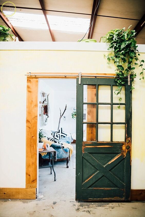s 17 of our favorite diy barn doors right now, Upcycle a thrifted door into a striking sliding barn door