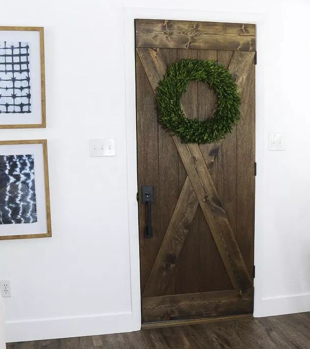s 17 of our favorite diy barn doors right now, Turn any wooden door into a faux barn door for next to nothing