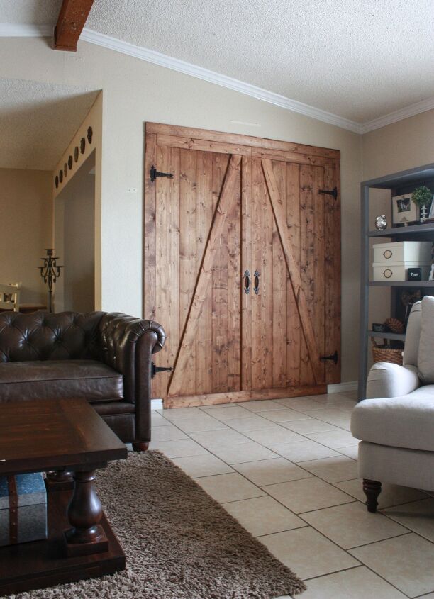 s 17 of our favorite diy barn doors right now, Close off an awkward space with a faux barn door room divider