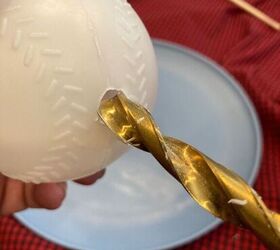 Drill a hole in a plastic baseball for this clever holiday hack