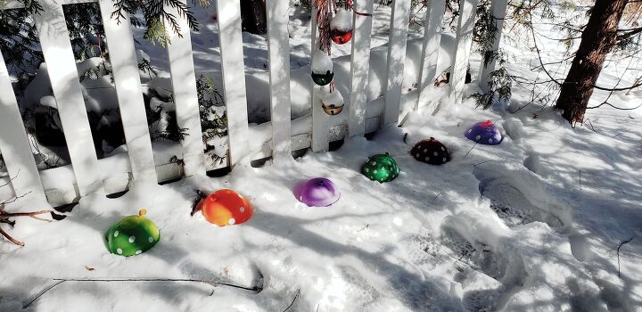 17 ways to make your front yard look like a winter wonderland, Add color to your yard with giant ice marbles