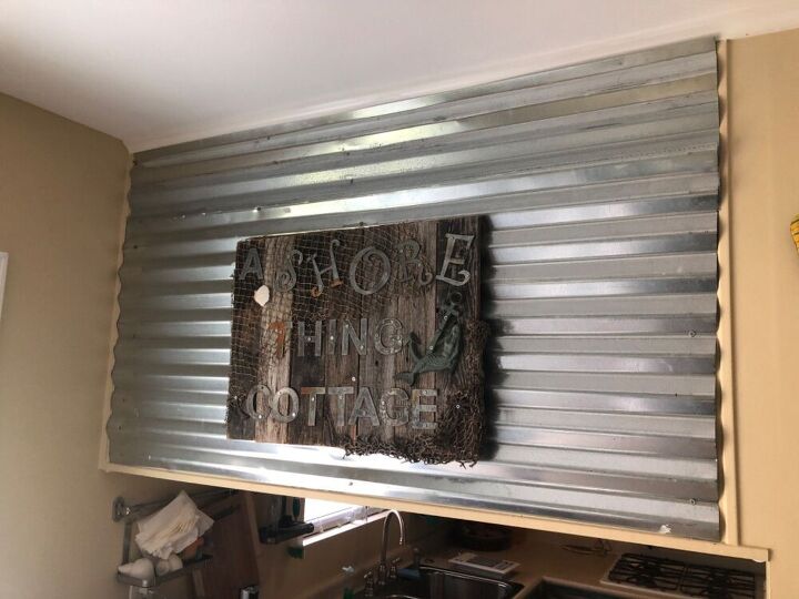 water damage to trendy metal wall, Adding metal to wall