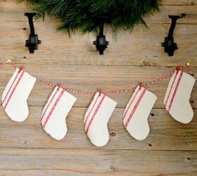 s 16 farmhouse holiday decor ideas that ll make you swoon, Repurpose a canvas drop cloth into a farm style stocking garland