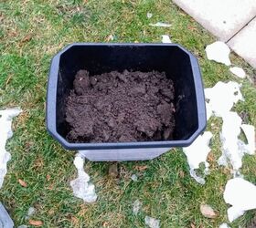 from garbage bin to winter planters, Adding soil