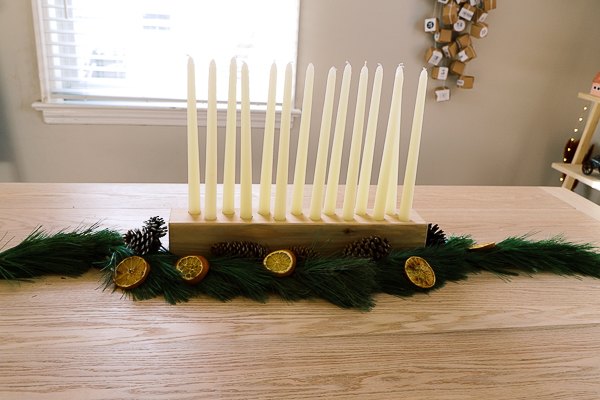 taper candles centerpiece with diy natural evergreen garland
