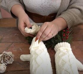 Stuff greenery into an old pair of mittens for the cutest accent