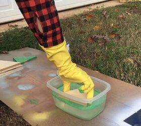 Dip wood pieces into a container of water to beautify your front door