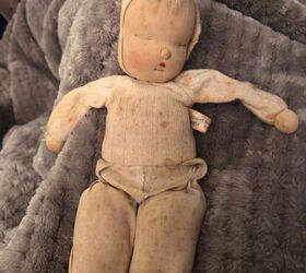 How do I clean an antique muslin doll?