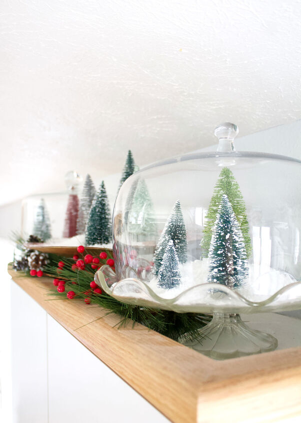 s 10 adorable ways people are decorating with bottle brush trees, Repurpose a cake stand into an adorable Christmas tree terrarium