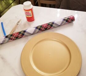 How she classes up her table using wrapping paper and an old charger