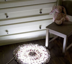 s 15 diy rugs to warm your floors this season, Add a gorgeous glow to your bedroom with a crocheted fairy light rug