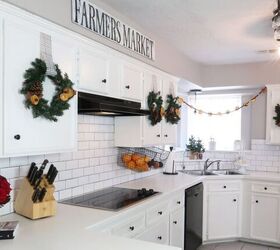 s 15 holiday wreath ideas you won t see on anyone else s front door, Decorate your kitchen cabinets with holiday c