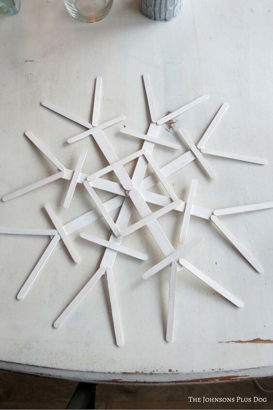 s 20 cute crafts for the kids to do while their stuck indoors, Turn popsicle sticks into beautiful delicate snowflakes