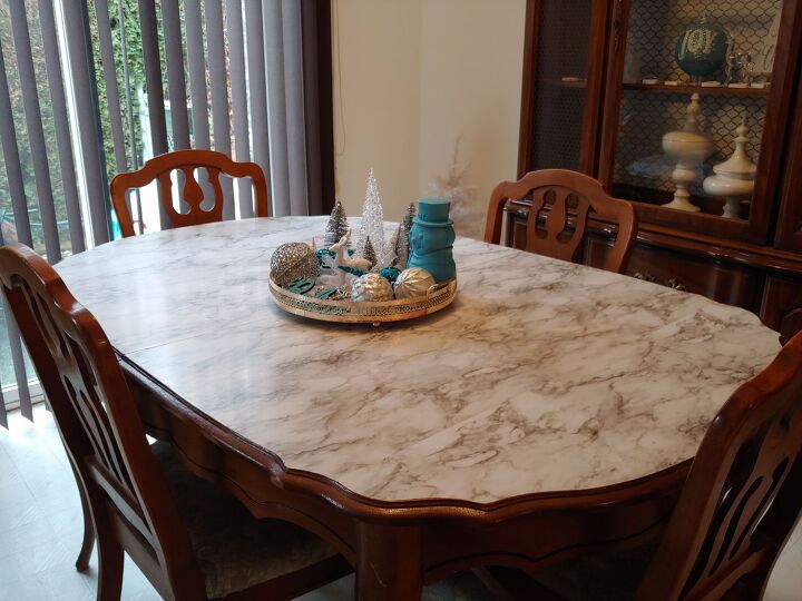 21 ways to bring your old dining table into 2021, Give your table a faux marble makeover with adhesive contact paper