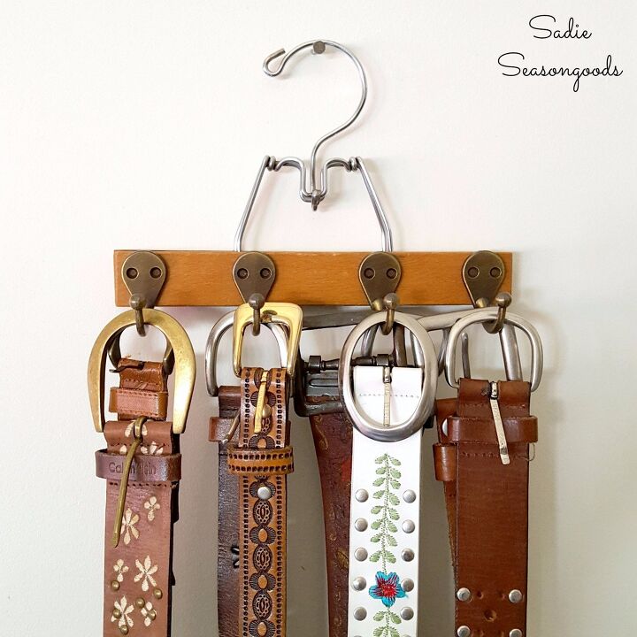s 15 brilliant ways to organize your closet for a cleaner year, Repurpose a wooden clamp hanger into a belt organizer