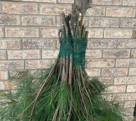 She tied together a bunch of branches to get this wacky and magical porch accent