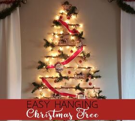 s 16 alternative christmas trees we re obsessed with this week, Craft an abstract tree wall hanging from wooden dowels and twine
