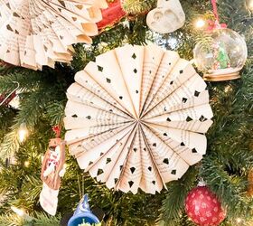 s 15 of our favorite christmas ornaments people made this year, Upcycle old book pages into gorgeous snowflake ornaments