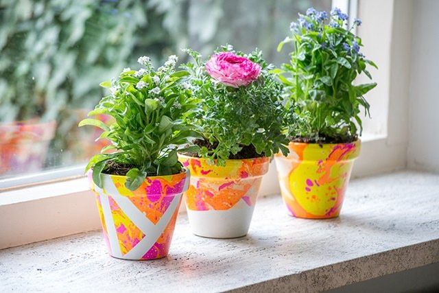 s boost your mood with these 12 colorful decor ideas, Brighten up flower pots with this fun marbling technique