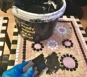 how to transform old coffee tables with mosaic, Grouting the table