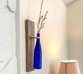 s 25 sweet upcycles that made us smile this month, Wine Bottle Wall Vase Decor