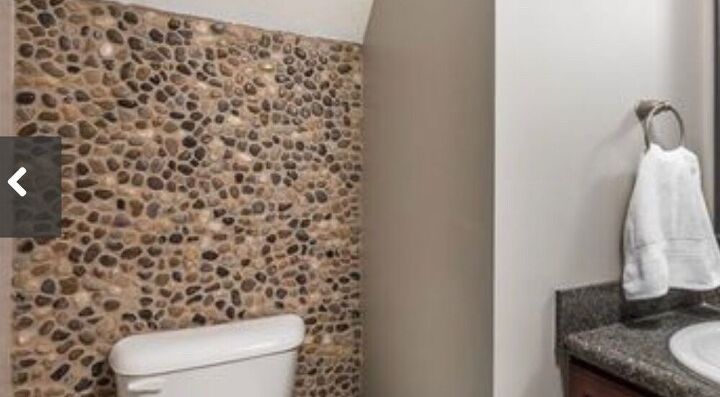 how can i update this pebble rock wall in my bathroom