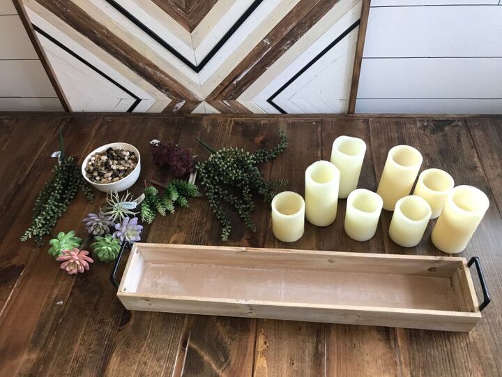 centro de mesa con velas y suculentas