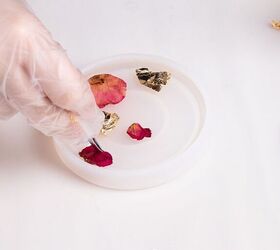 She puts petals and gold flakes into a dish to get this gorgeous countertop accent