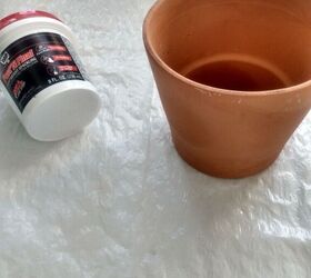 how to make aged clay pots using dollar store spackle, Dollar store spackle and clay pot