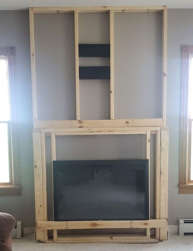 how to build a diy stone fireplace, We added 2x4s to support the fireplace insert on all sides