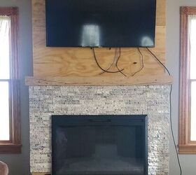 how to build a diy stone fireplace, The stone tile going up