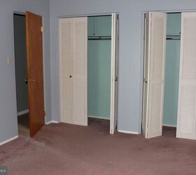 They took the doors off their old closet for this gorgeous, farmhouse-style makeover