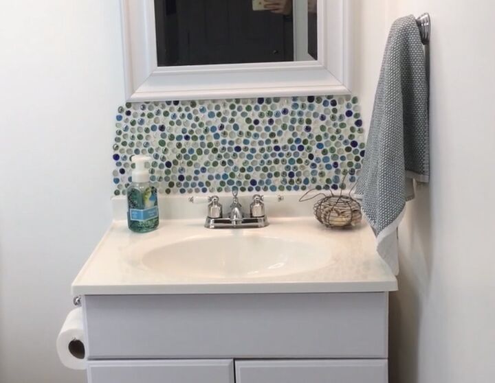 20 bathroom updates that ll make you smile while you brush your teeth, Turn dollar store gems into a sparkling backsplash