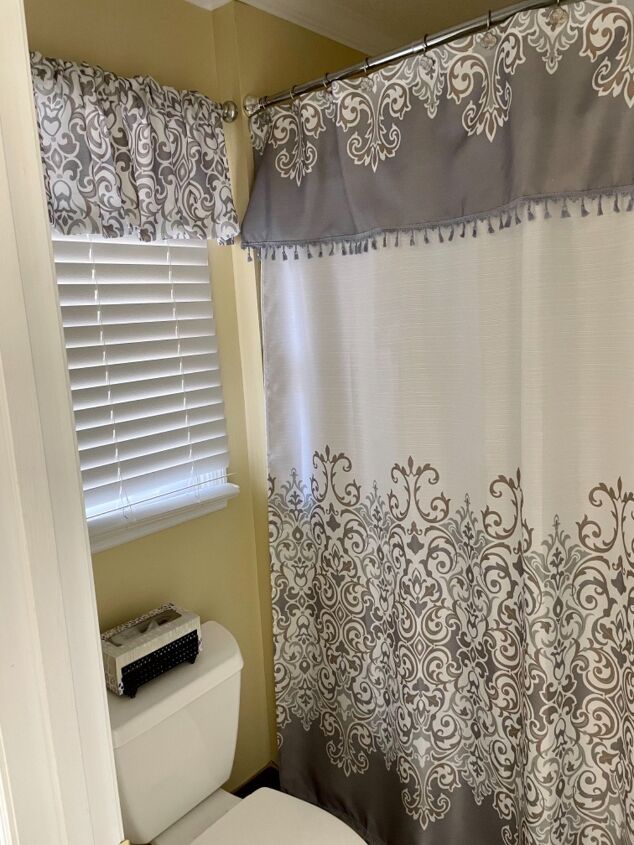 20 bathroom updates that ll make you smile while you brush your teeth, Coordinate your shower curtain and window valance