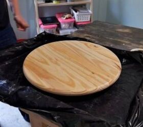 Eager to start upgrading her outdoor space, she used a wood round to do this
