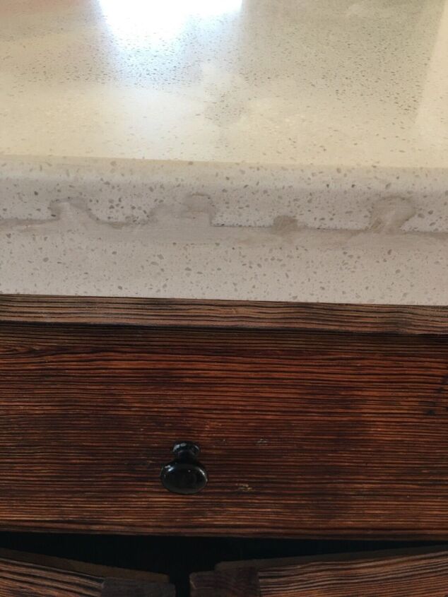 q how do i fix or cover this quartz seam nightmare