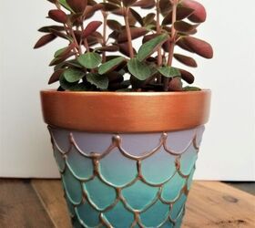 s 20 ways to update your flowers pots in time for spring, Add painted fins for an under the sea vibe