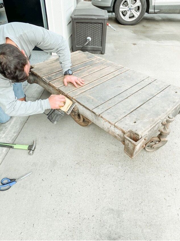 how to restore an old railroad cart into a coffee table, Don t forget to sand the sides down too