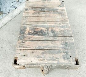 how to restore an old railroad cart into a coffee table, Here you can really see the black paint shining through on the tabletop