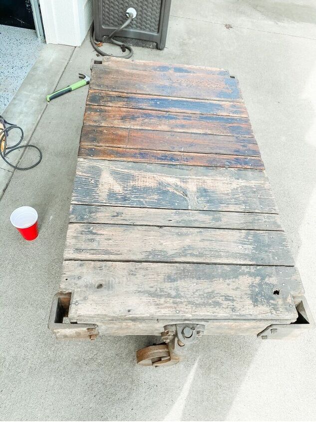 how to restore an old railroad cart into a coffee table, You can really see the difference here after you apply the sealer