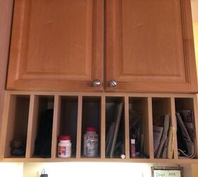 how can i cover up my plate rack cubbies under my kitchen cabinets
