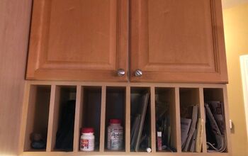How can I cover up my plate rack/cubbies under my kitchen cabinets?