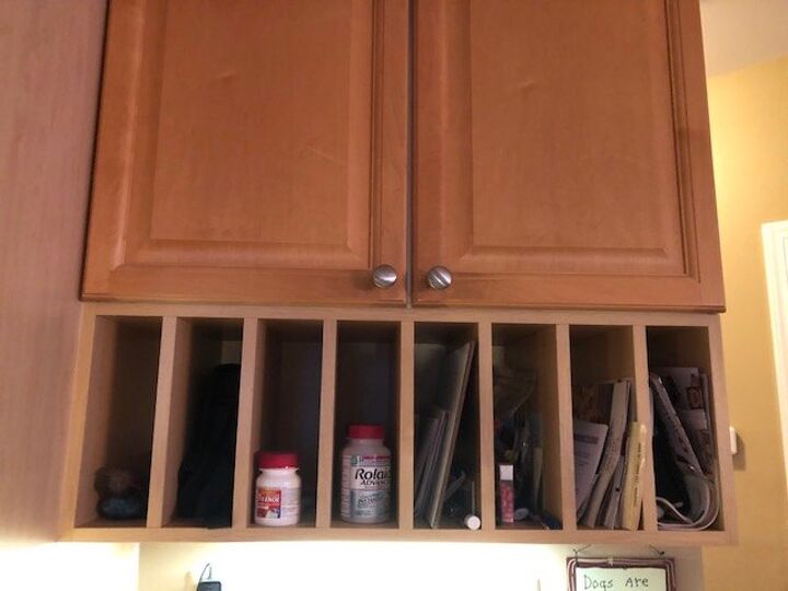 q how can i cover up my plate rack cubbies under my kitchen cabinets