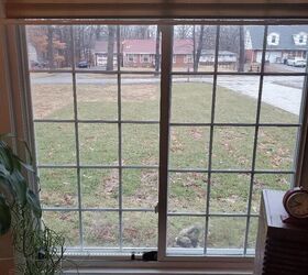 How do you remove the vinyl window slats in a sliding window?
