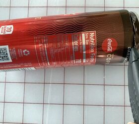 She cuts the top off a soda can and ends up with a surprisingly delicate wall accent