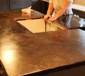 Instead of replacing her countertops, she tapes them off and does this for $200