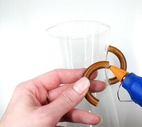 Use curtain rings and a water jug to create this designer look
