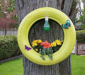 25 spring porch ideas that ll brighten up your block, Decorated hanging tire planter